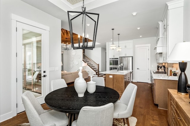dining space with dark wood-style floors, recessed lighting, and stairway