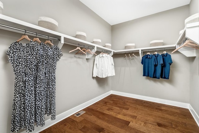 spacious closet featuring wood finished floors and visible vents