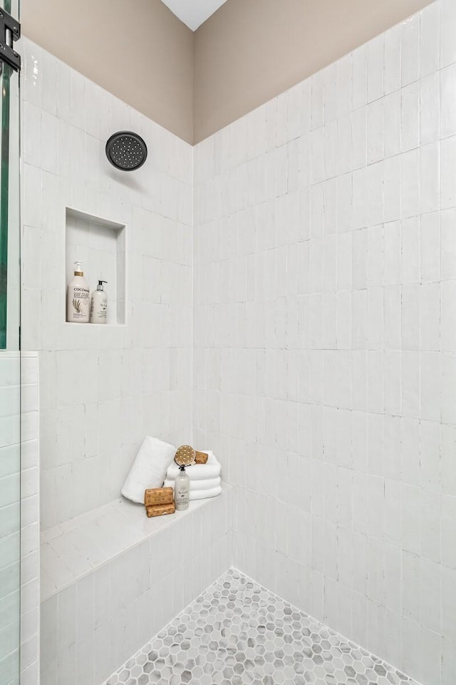 full bathroom with tiled shower