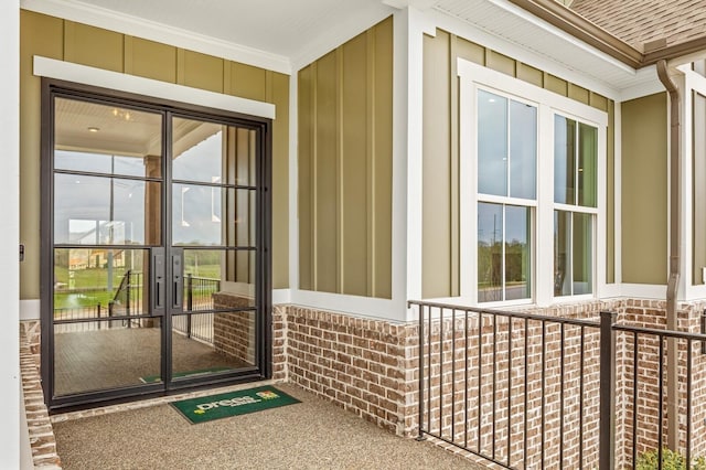doorway to property with board and batten siding
