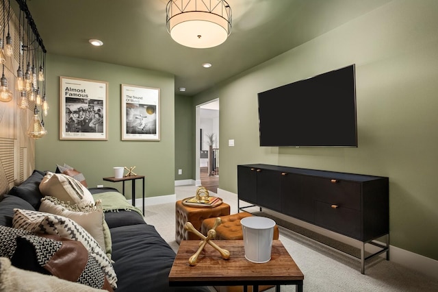 living room featuring recessed lighting, baseboards, and carpet