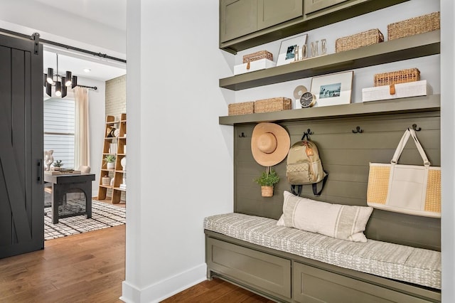 mudroom with baseboards and dark wood-style flooring