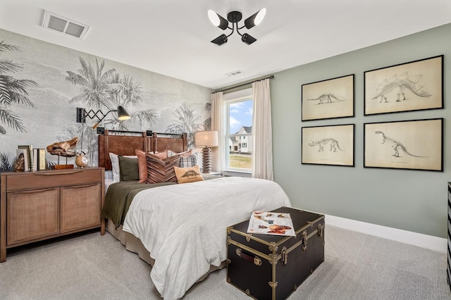 bedroom with baseboards, carpet floors, wallpapered walls, and visible vents