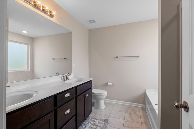 full bathroom with double vanity, toilet, baseboards, and a sink