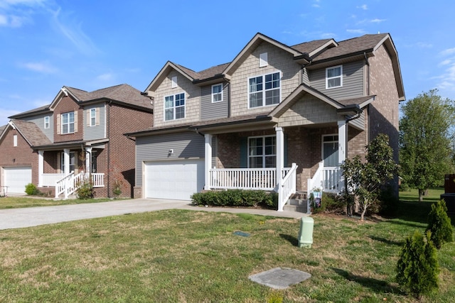 view of front of house featuring an attached garage, driveway, covered porch, brick siding, and a front yard