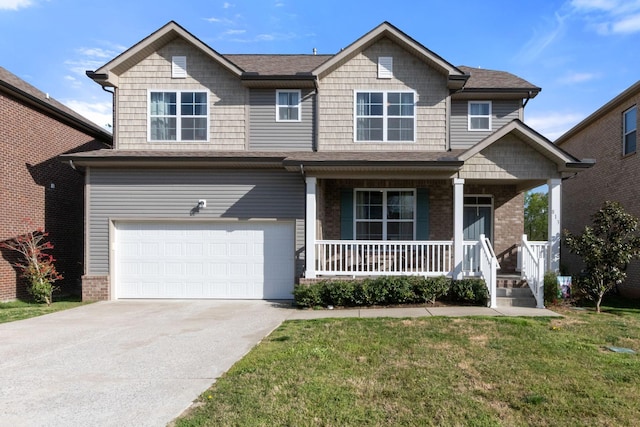 view of front of home with driveway, covered porch, a garage, a shingled roof, and a front yard