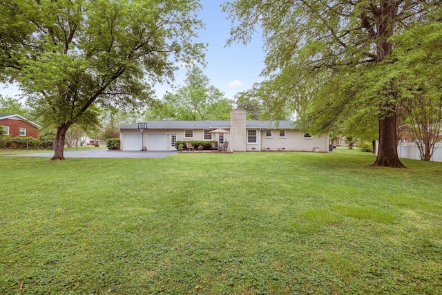 110 Ewingville Dr, Franklin, TN 37064 - view of front of house featuring asphalt driveway, a chimney, an attached garage, and a front lawn