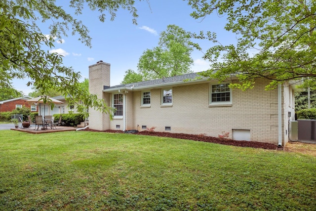 110 Ewingville Dr, Franklin, TN 37064 - back of property with a chimney, brick siding, a lawn, and crawl space