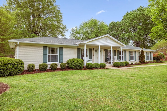 110 Ewingville Dr, Franklin, TN 37064 - view of front of property with a porch, a front lawn, and brick siding