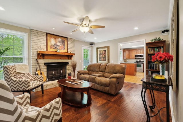 110 Ewingville Dr, Franklin, TN 37064 - living room with a ceiling fan, dark wood finished floors, a fireplace, ornamental molding, and recessed lighting