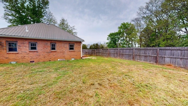 view of yard with a fenced backyard