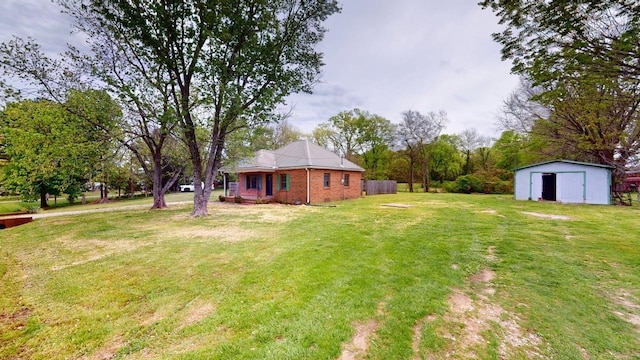 view of yard with an outdoor structure and a shed