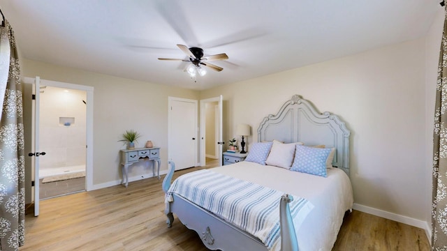 bedroom with connected bathroom, ceiling fan, baseboards, and light wood finished floors