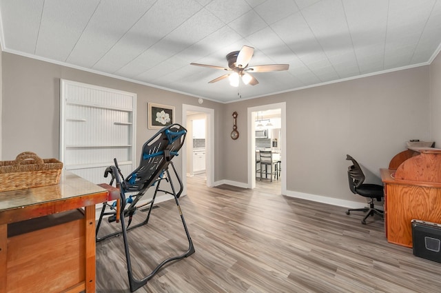 96 Concord Cades Rd, Milan, TN 38358 - home office featuring baseboards, a ceiling fan, wood finished floors, and crown molding