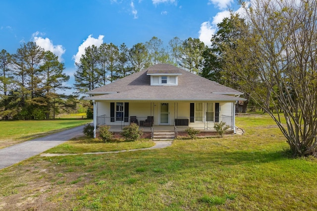 96 Concord Cades Rd, Milan, TN 38358 - view of front facade with a front lawn, roof with shingles, aphalt driveway, and covered porch