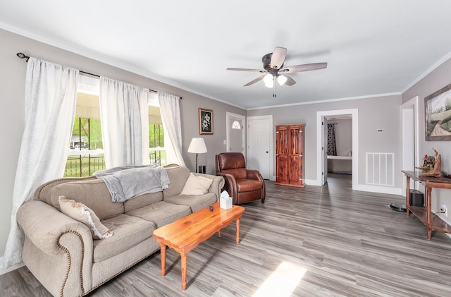 96 Concord Cades Rd, Milan, TN 38358 - living room with light wood-type flooring, visible vents, ornamental molding, and ceiling fan