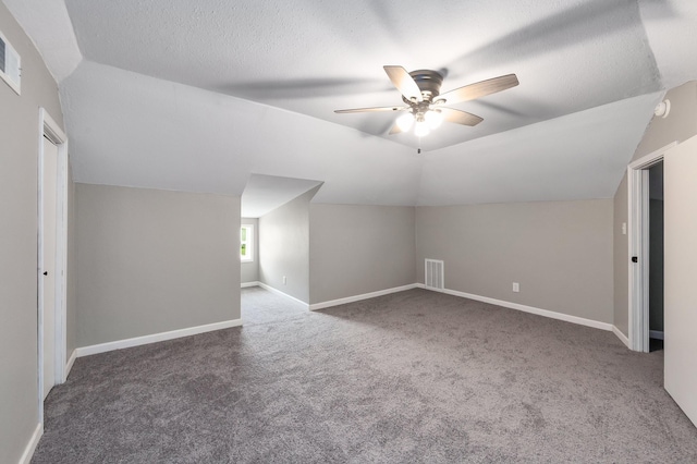 96 Concord Cades Rd, Milan, TN 38358 - additional living space featuring vaulted ceiling, visible vents, baseboards, carpet flooring, and ceiling fan