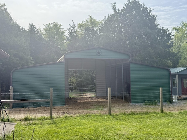 view of outdoor structure featuring fence