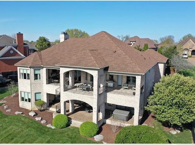 889 Plantation Blvd, Gallatin, TN 37066 - rear view of house featuring a patio area, a lawn, and a balcony