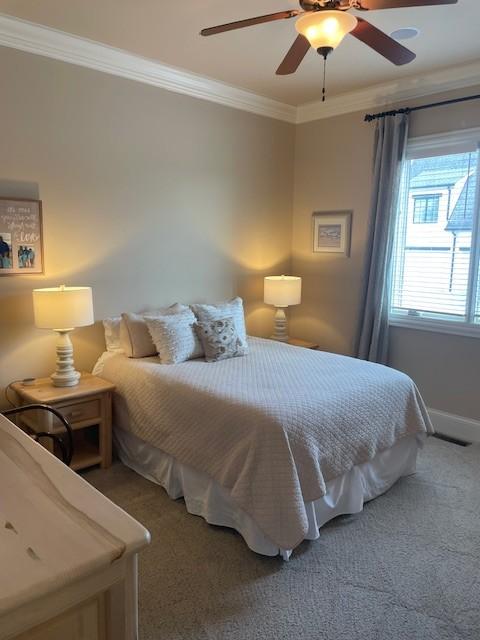 889 Plantation Blvd, Gallatin, TN 37066 - bedroom featuring baseboards, a ceiling fan, light colored carpet, and ornamental molding