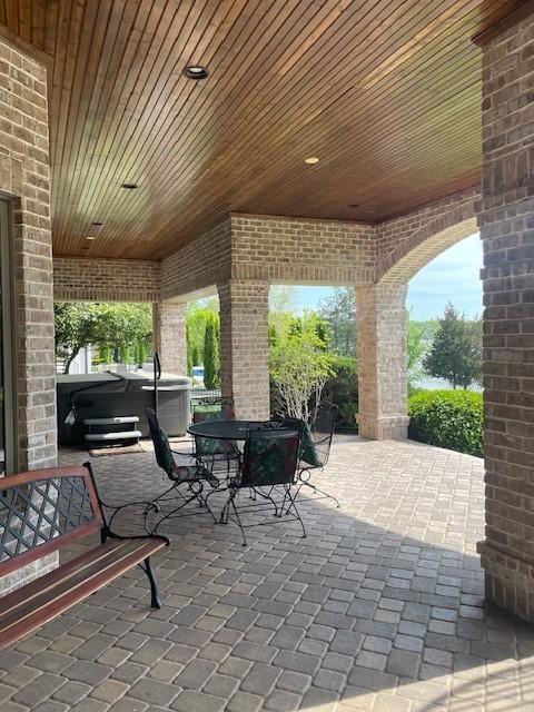 889 Plantation Blvd, Gallatin, TN 37066 - view of patio with outdoor dining area and a hot tub