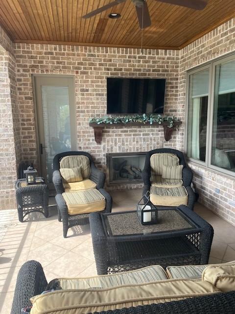 889 Plantation Blvd, Gallatin, TN 37066 - view of patio / terrace featuring an outdoor living space with a fireplace and ceiling fan