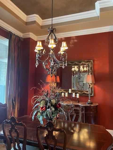 889 Plantation Blvd, Gallatin, TN 37066 - dining area with an inviting chandelier, crown molding, and a tray ceiling