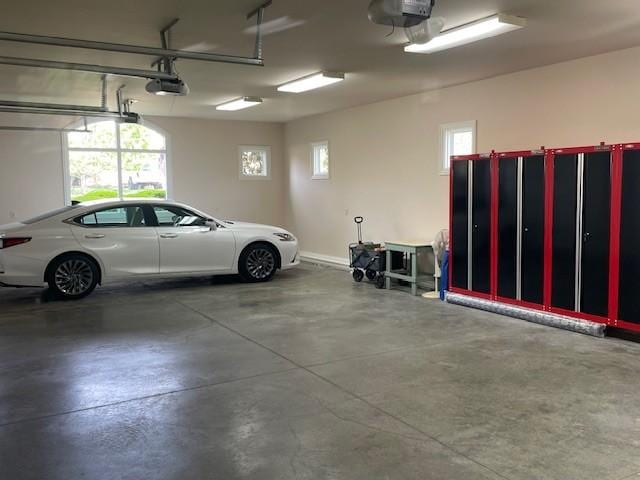 889 Plantation Blvd, Gallatin, TN 37066 - garage with a garage door opener and baseboards