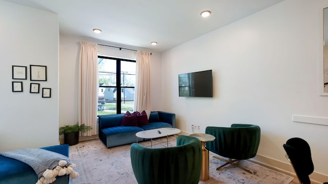 sitting room featuring baseboards and recessed lighting