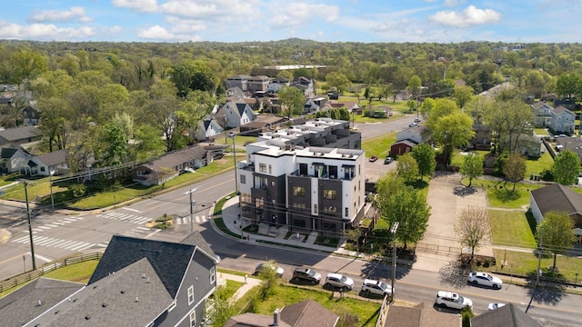 aerial view featuring a view of trees and a residential view