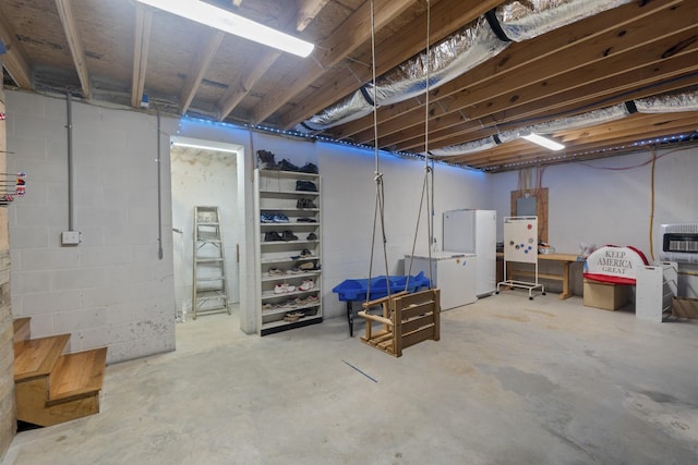 6336 Hickory Dr, Centerville, TN 37033 - unfinished basement featuring heating unit and freestanding refrigerator