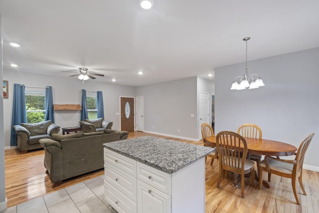 6336 Hickory Dr, Centerville, TN 37033 - kitchen featuring white cabinets, recessed lighting, ceiling fan, decorative light fixtures, and light stone counters