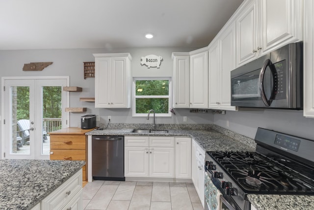6336 Hickory Dr, Centerville, TN 37033 - kitchen featuring stainless steel appliances, healthy amount of natural light, white cabinets, light tile patterned floors, and recessed lighting