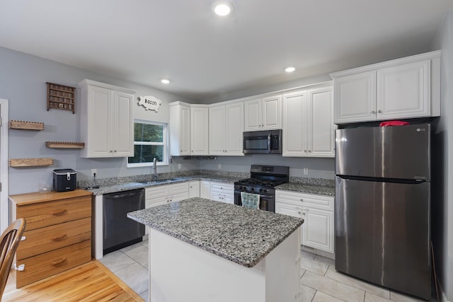 6336 Hickory Dr, Centerville, TN 37033 - kitchen with appliances with stainless steel finishes, white cabinets, light stone counters, light tile patterned flooring, and recessed lighting