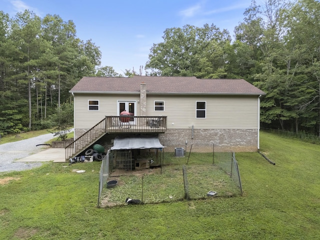 6336 Hickory Dr, Centerville, TN 37033 - back of property with a deck, a lawn, and stairs