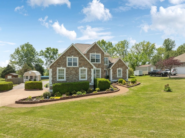 view of front of home with stone siding and a front lawn