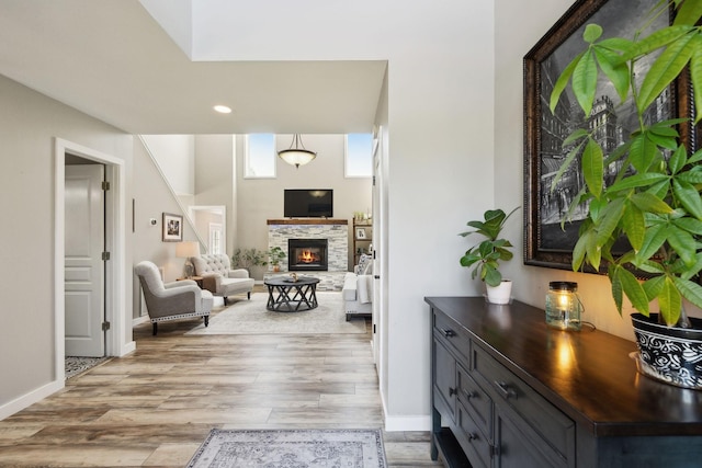 interior space with baseboards, recessed lighting, and light wood-style flooring