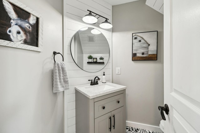 bathroom featuring baseboards and vanity