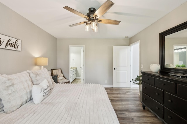 bedroom with baseboards, a ceiling fan, connected bathroom, and wood finished floors