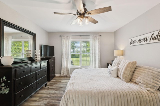 bedroom featuring ceiling fan and wood finished floors