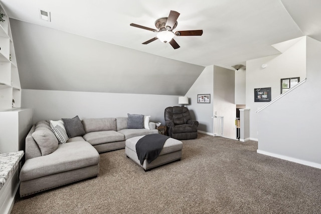living area featuring visible vents, lofted ceiling, baseboards, a ceiling fan, and carpet