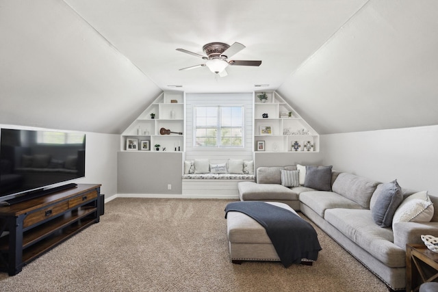 living room with built in features, a ceiling fan, carpet flooring, and lofted ceiling