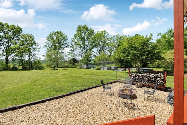 view of yard featuring a fire pit