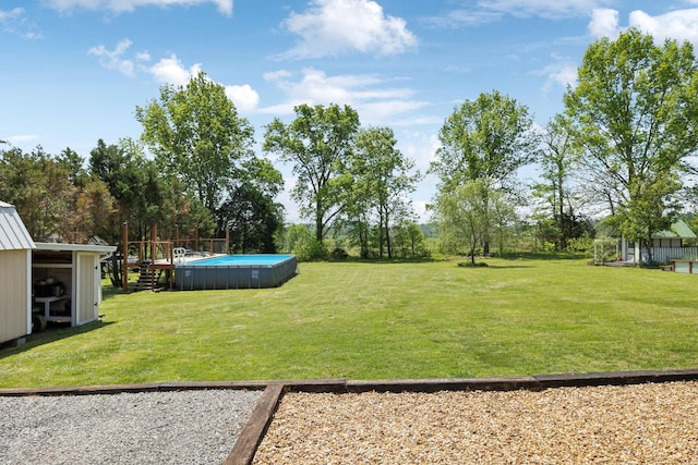 view of yard featuring an outdoor pool