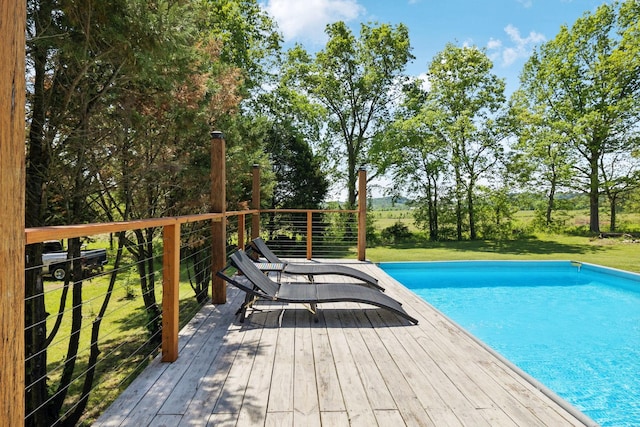 pool with a lawn and a deck
