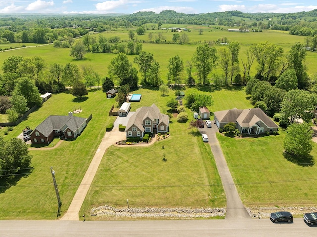 birds eye view of property with a rural view