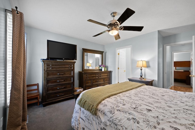 bedroom with dark carpet and ceiling fan