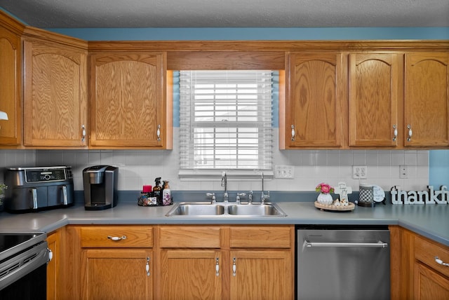 kitchen featuring decorative backsplash, dishwasher, light countertops, and a sink