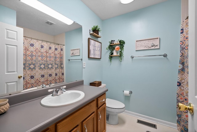 full bath with toilet, vanity, visible vents, and baseboards