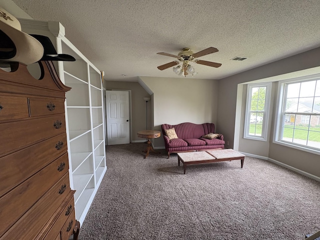 2413 Tana Way, Clarksville, TN 37042 - carpeted living room featuring a textured ceiling, visible vents, baseboards, and ceiling fan